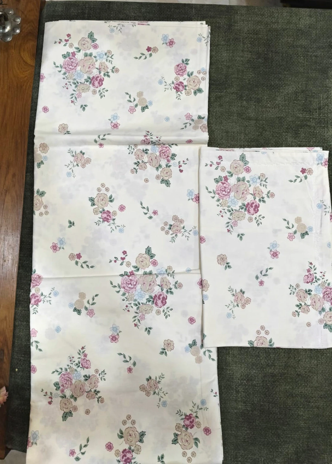 The Chintz: small pink and grey roses scattered on white, folded.