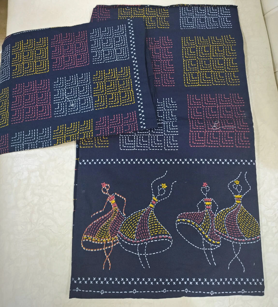 The Dancers, navy: dancing figures and square panels in ochre, rose and white on navy cotton, folded.