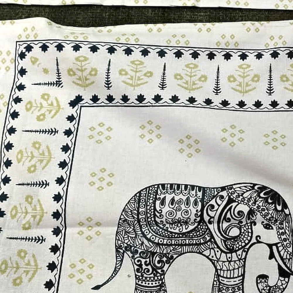 Close-up of The Elephant Parade: rows of small elephants in rose and grey on white, with elephant-panel pillowcases.