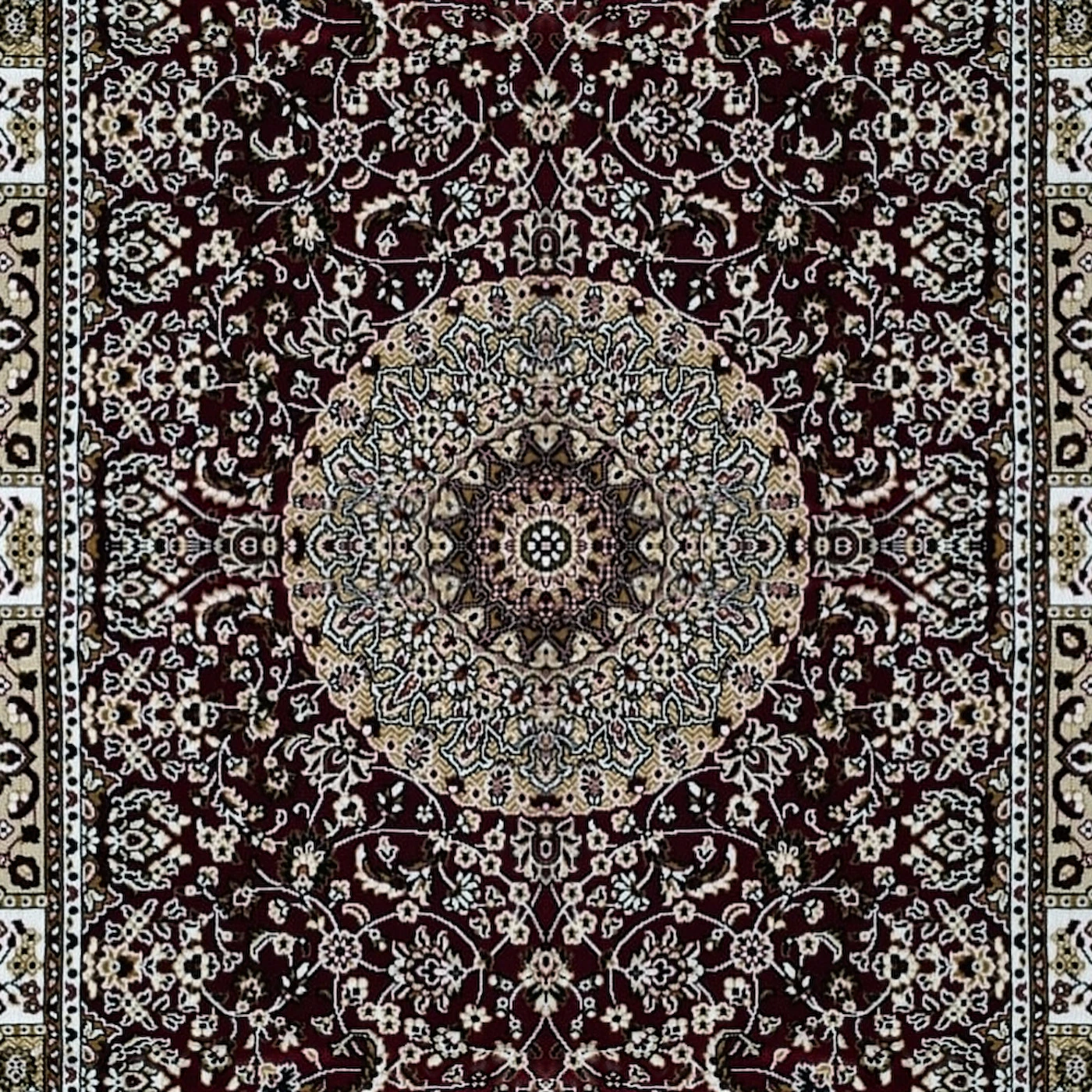 Close-up of The Madder Medallion: deep maroon with a round ivory and grey-blue medallion and an ivory and gold border.