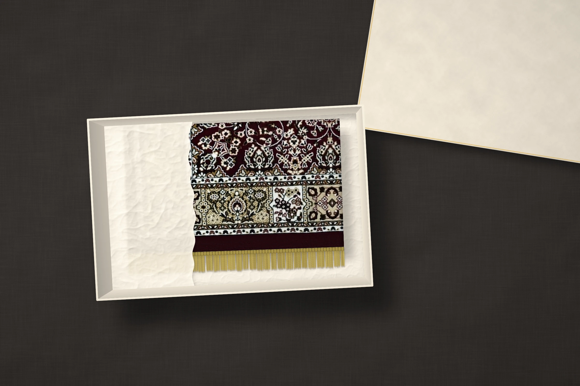 The Madder Medallion: deep maroon with a round ivory and grey-blue medallion and an ivory and gold border, folded in ivory tissue inside a gift box.