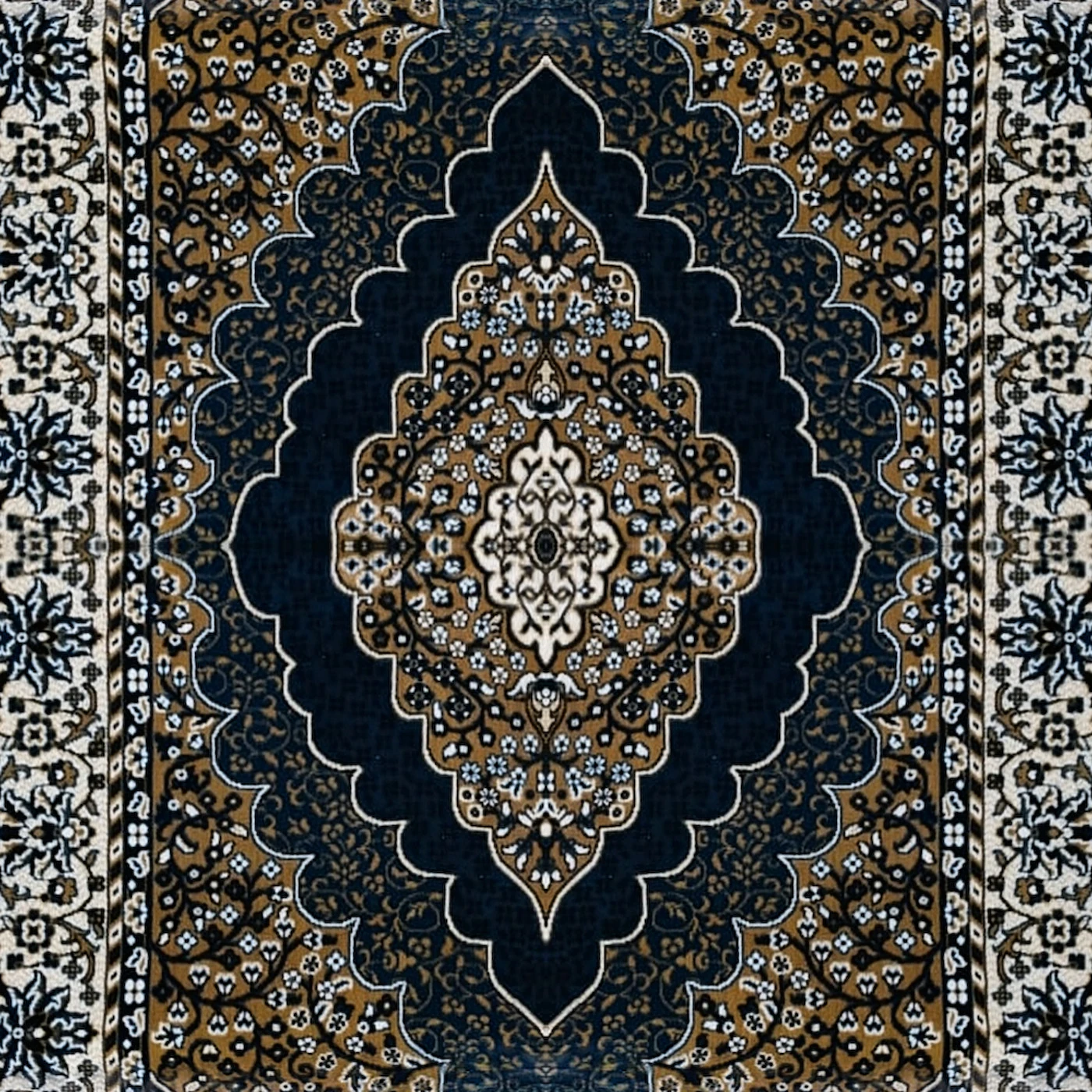 Close-up of The Saffron Medallion: ochre field with a navy scalloped medallion, a cream border of blue flowers and a navy edge.
